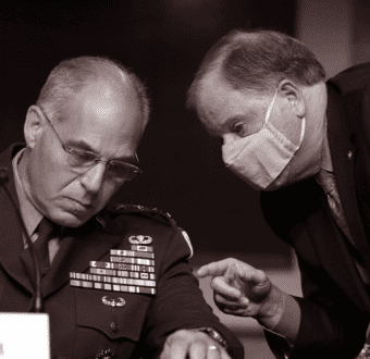 General Gustave F. Perna at a meeting