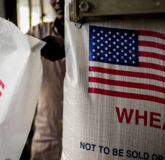 Djiboutian workers fill bags with wheat destined for Ethiopia