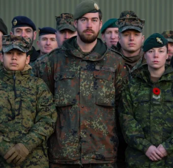 Group of multinational NATO soldiers in camouflage uniforms representing allied military cooperation and international security