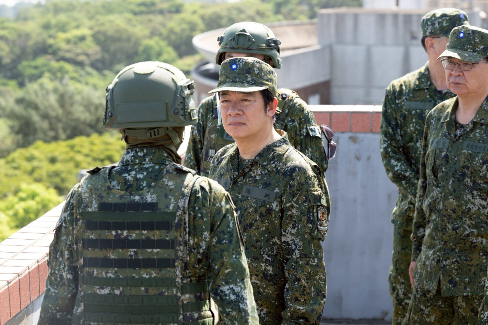 President Lai Ching Te in military dress inspects Taiwanese forces.