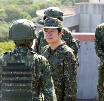 President Lai Ching Te in military dress inspects Taiwanese forces.