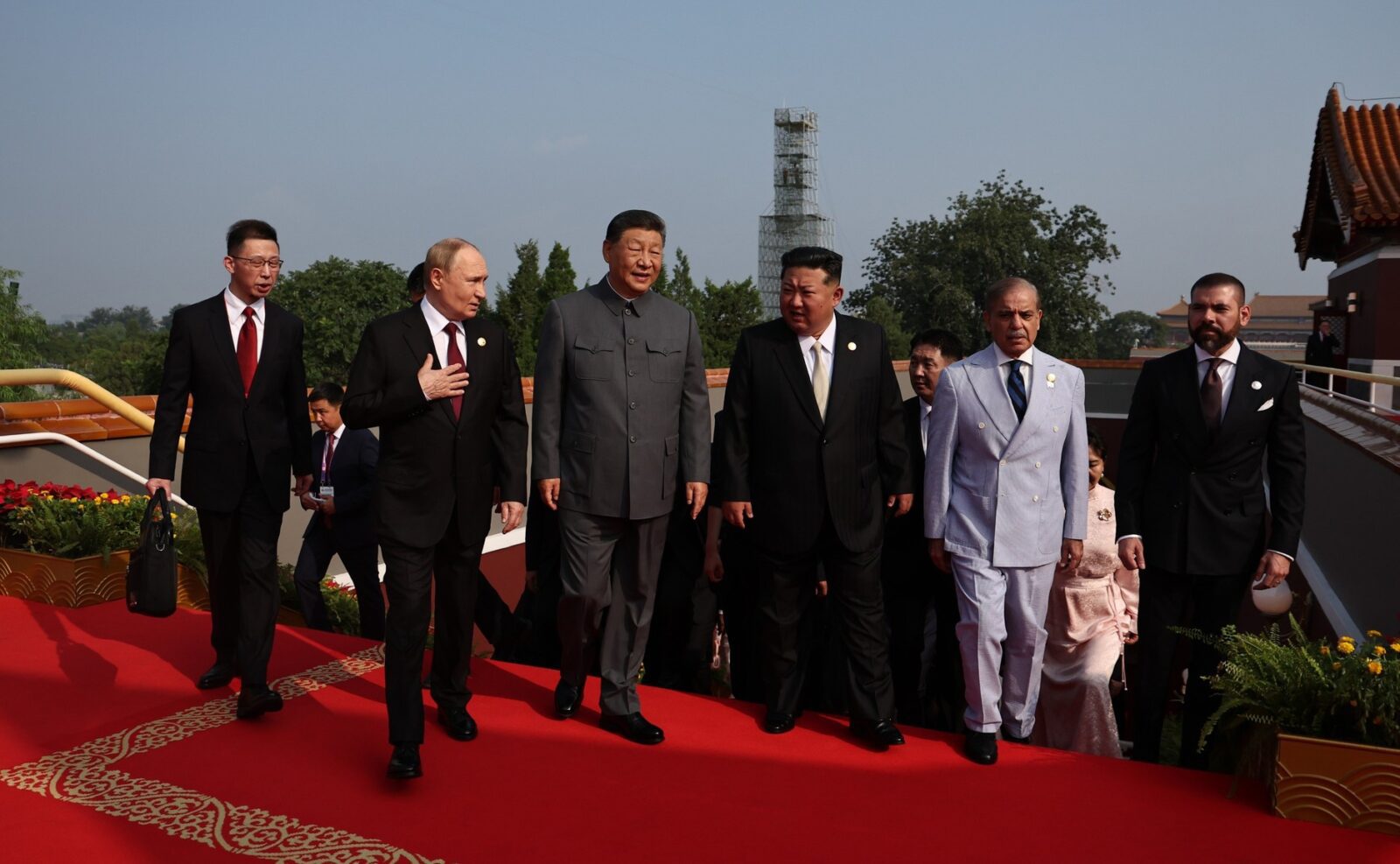 Russia's Vladimir Putin, China's Xi Jinping, and North Korea's Kim Jong Un walk together during celebrations in Beijing.