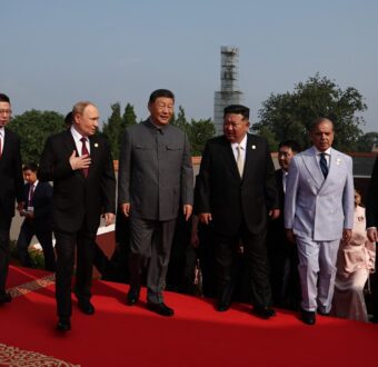Russia's Vladimir Putin, China's Xi Jinping, and North Korea's Kim Jong Un walk together during celebrations in Beijing.
